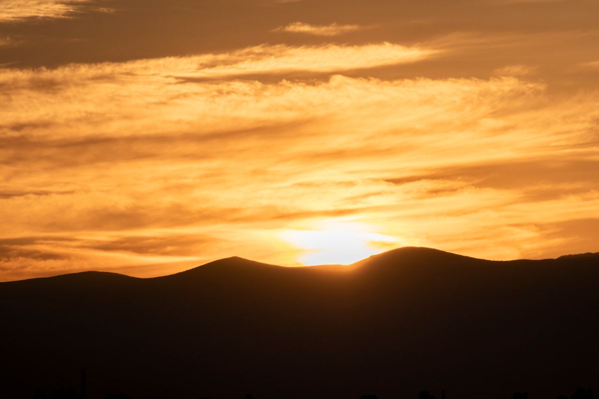 Sunrise over rolling hills